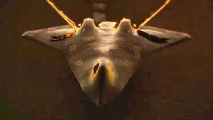 What does the -f flag in tail do?