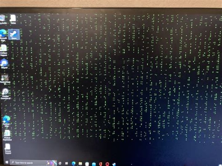 Why am I seeing red dots on my LCD screen?